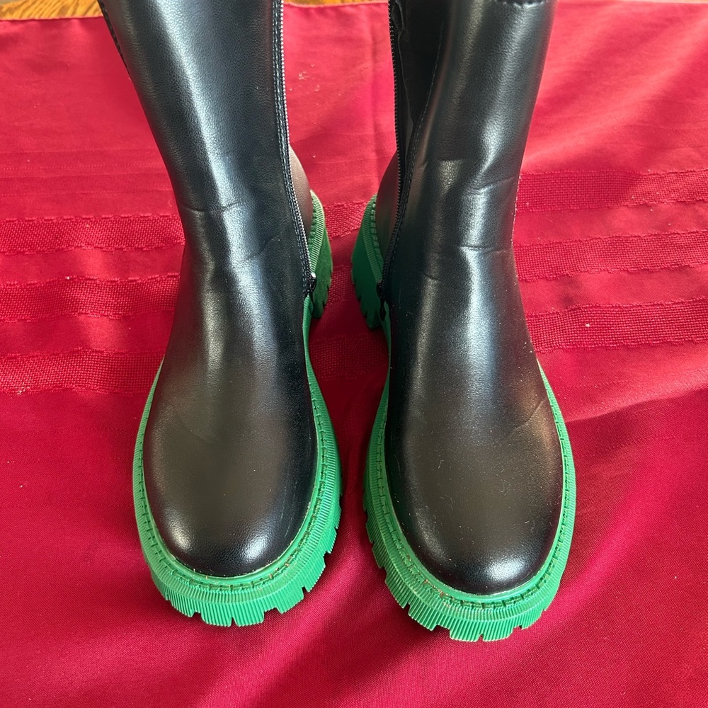Stylist black boots with a bright green heel. These boots are fun!!!